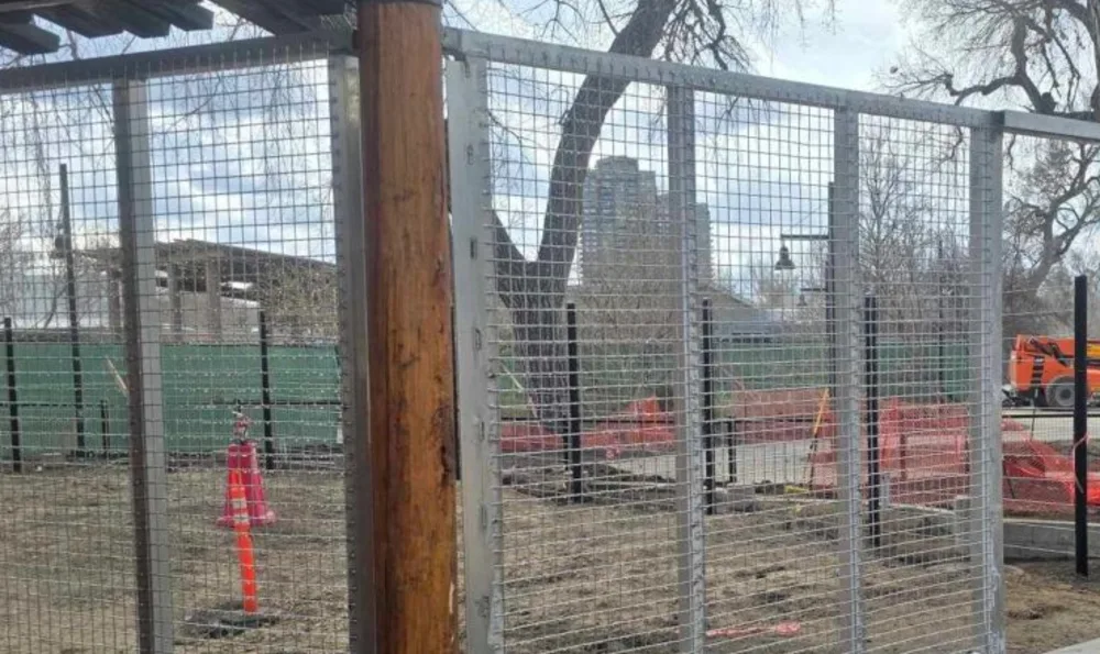 Galvanized welded wire mesh panels in reinforced steel frames forming a zoo enclosure wall, fabricated by TCB Metal Works